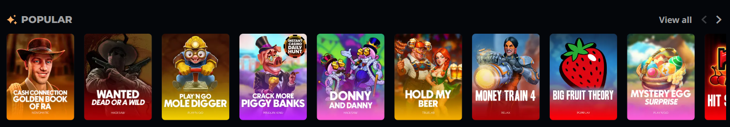 Popular online casino games section featuring top slots like Wanted Dead or a Wild, Money Train 4, and Big Fruit Theory with a scrollable game carousel.